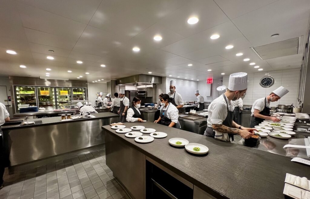 Staff cooking in he kitchen at Eleven Madison Park in NYC.