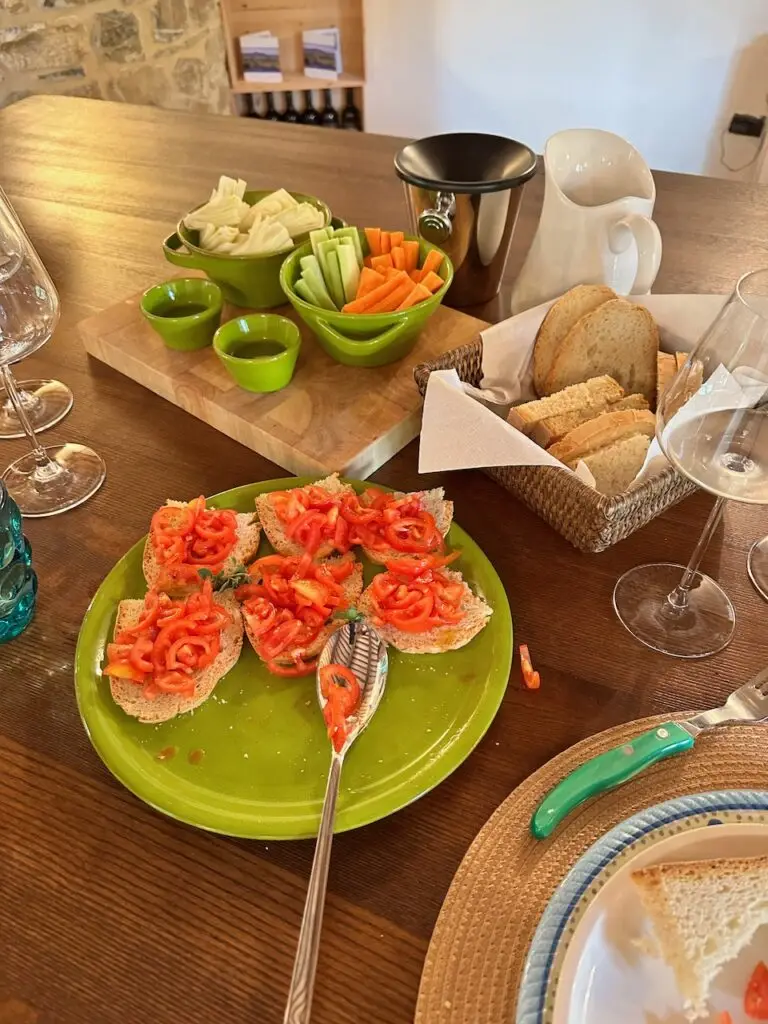 Various Italian meats, bread, vegetables.