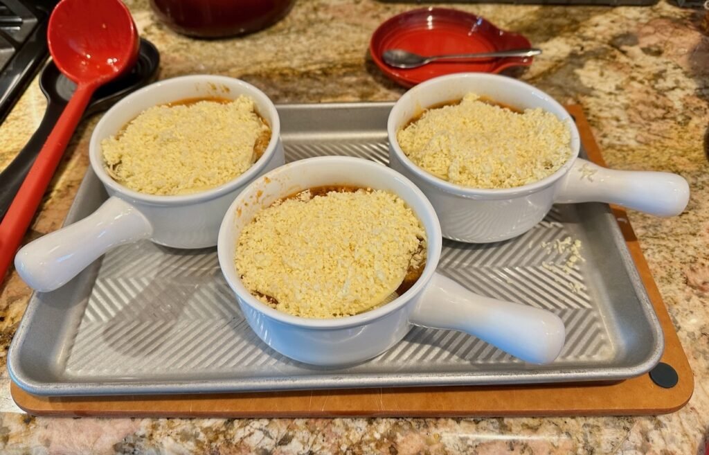 Bowls of French Onion soup before going into oven.