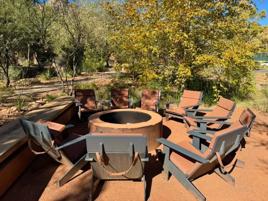 Outdoor firepit seating area surrounded by desert landscape at Enchantment Resort in Sedona.