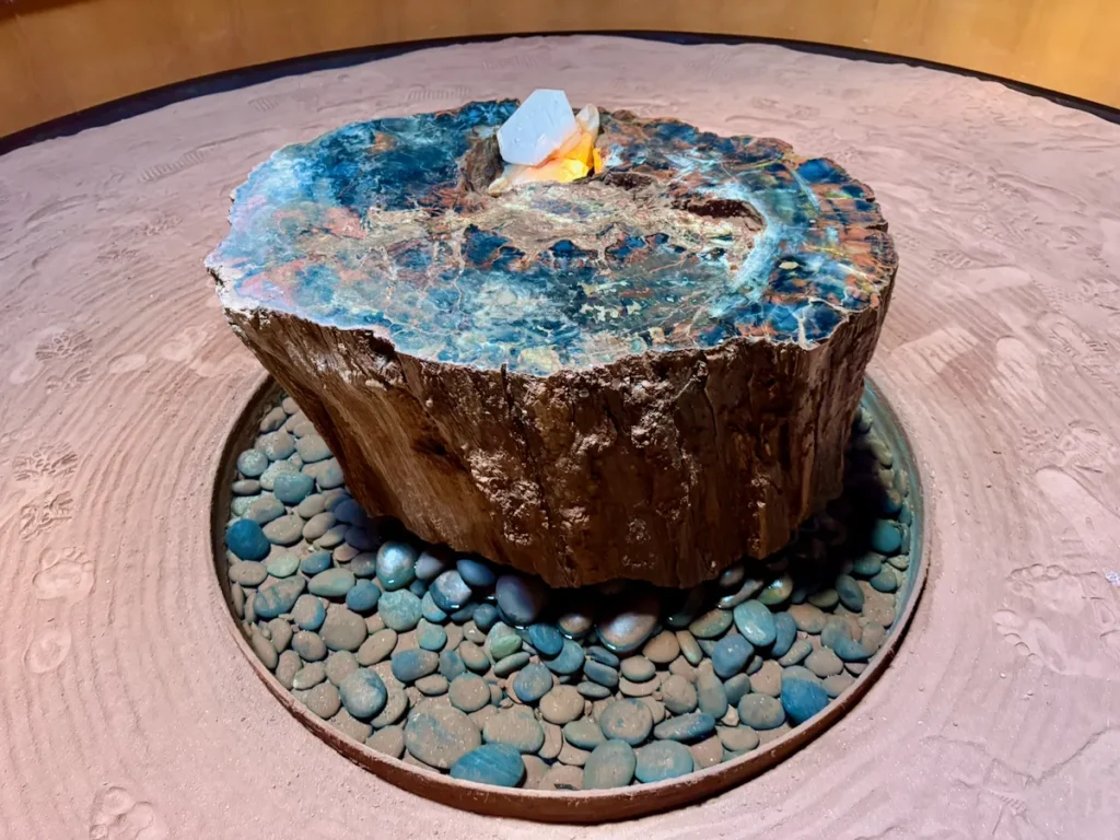 Meditation room featuring a polished stone centerpiece and tranquil design.