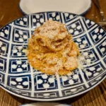 Tagliolini al ragù with grated cheese at Rezdôra in New York City