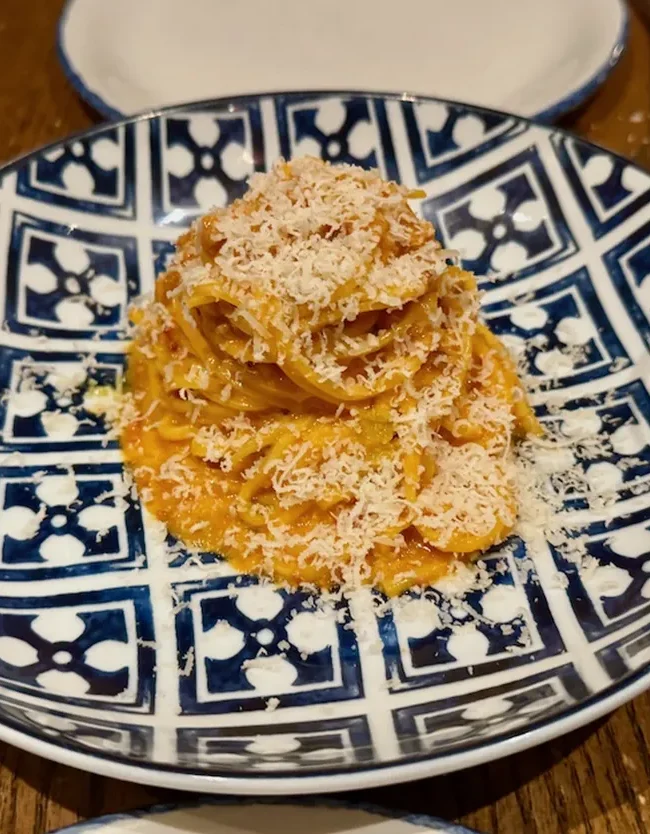 Tagliolini al ragù with grated cheese at Rezdôra in New York City