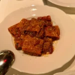 Maccheroni amatriciana at Torrisi Restaurant & Bar in New York City, featuring pasta in a rich tomato sauce