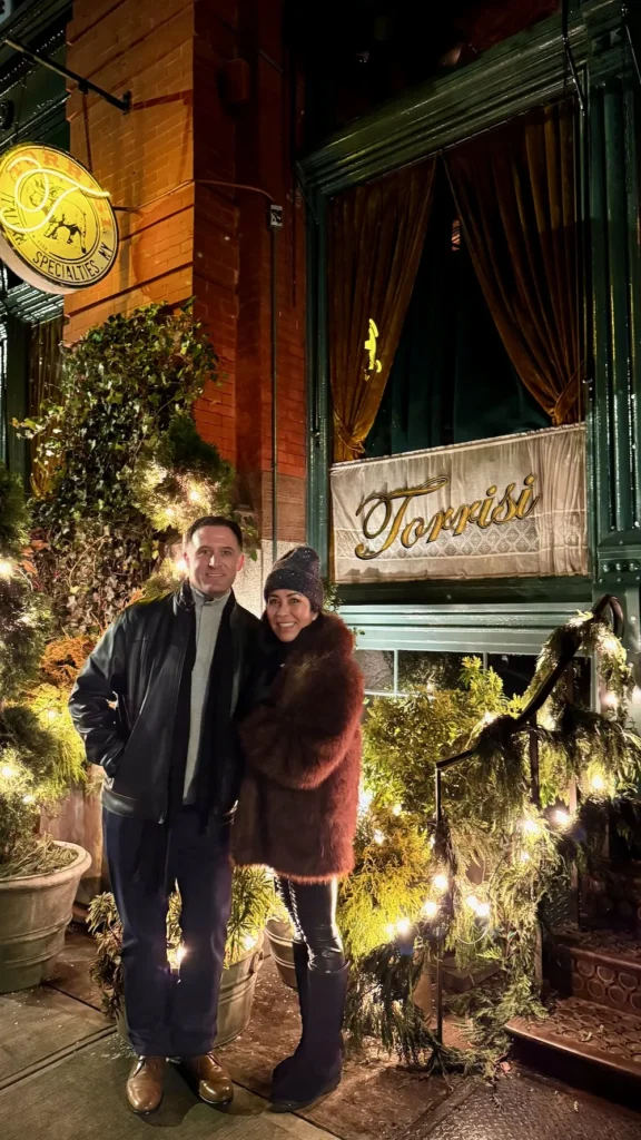 Phoebe Chongchua and John Pollard outside Torrisi Restaurant & Bar in New York City at night