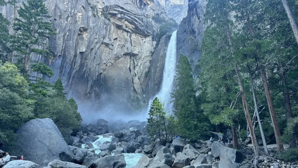Lower Yosemite Fall rushing over granite boulders in Yosemite National Park.