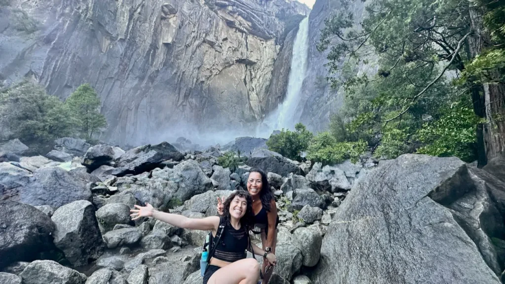 Phoebe Chongchua and Siena near Lower Yosemite Fall in Yosemite National Park.
