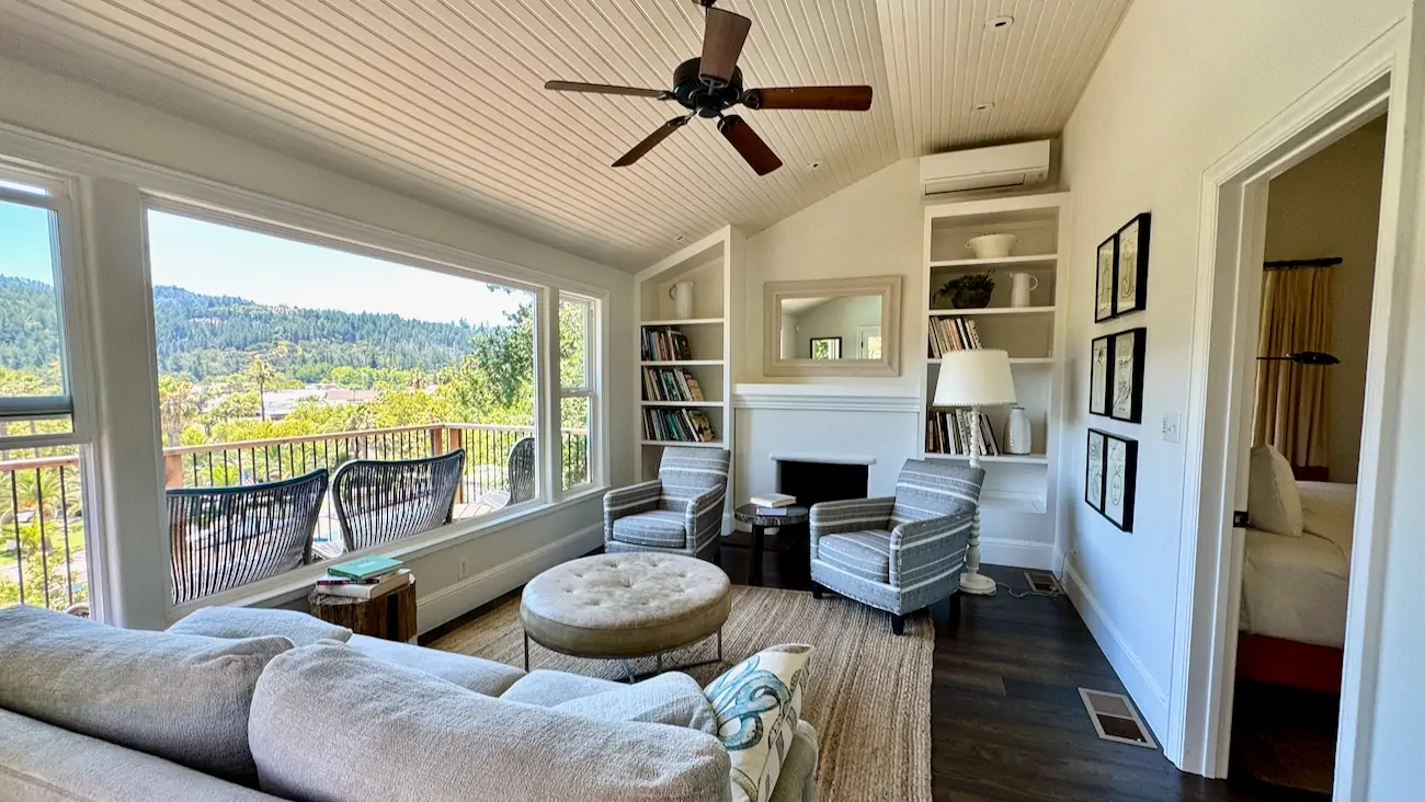 The comfortable living room inside Hill House overlooking Indian Springs Calistoga.