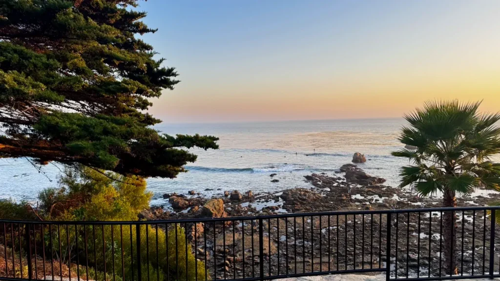 Sunset over Laguna Beach coastline from a coastal walking path