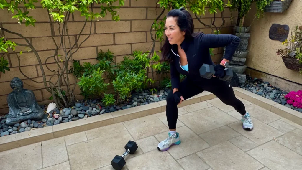 Phoebe Chongchua strength training outdoors during a midlife wellness workout