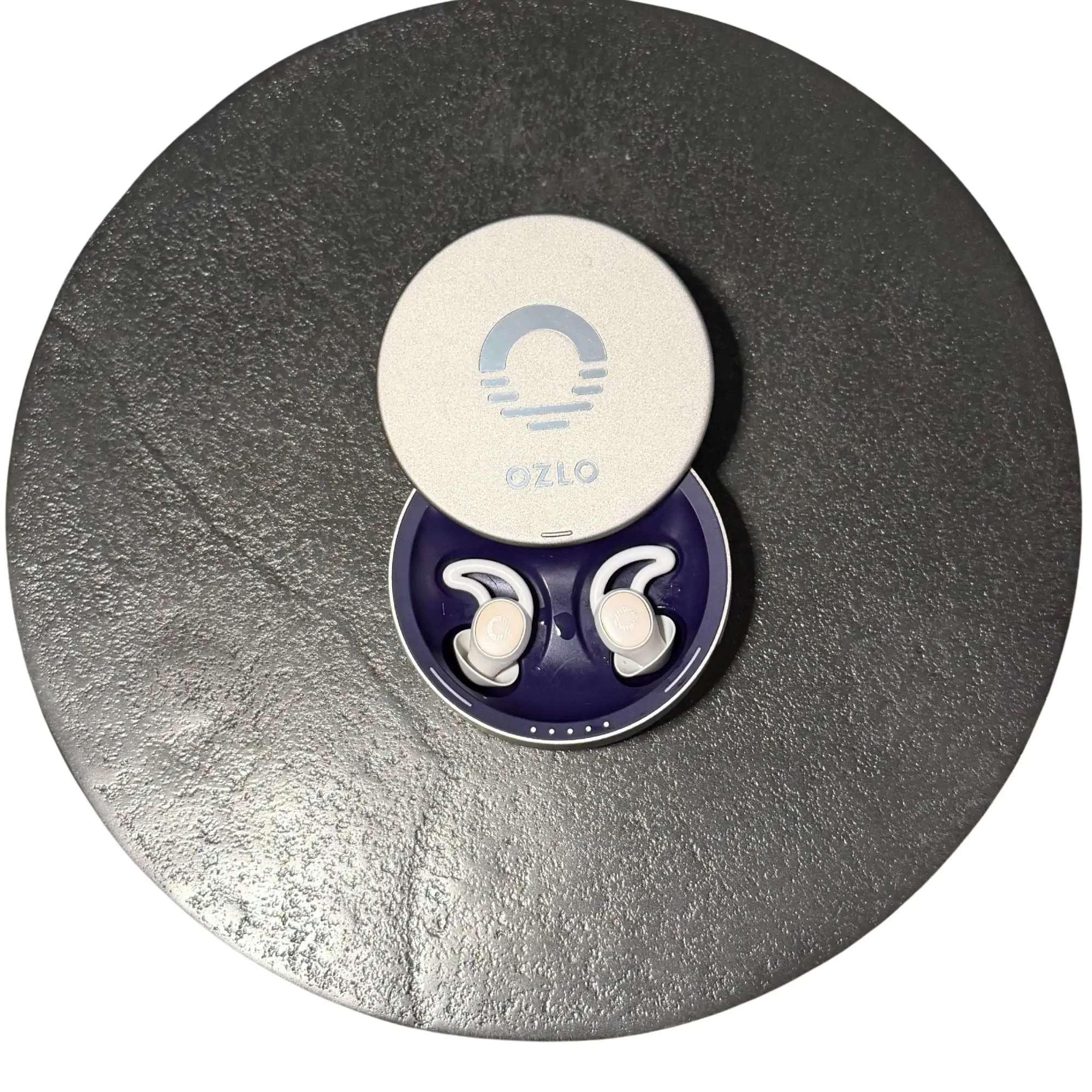 Ozlo Sleepbuds in open charging case