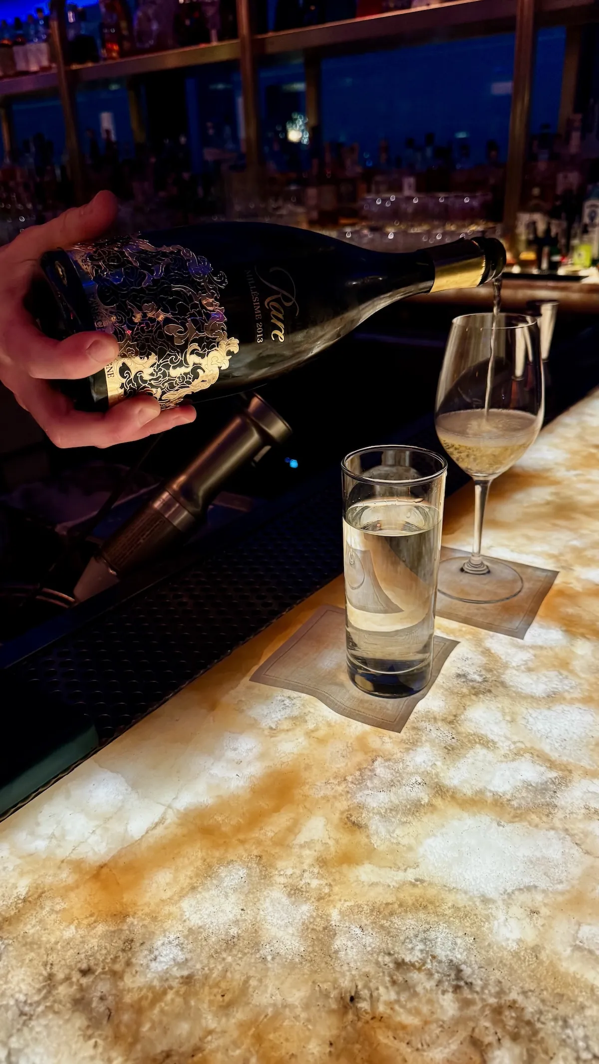 Rare Champagne 2013 being poured at Nubeluz rooftop bar at The Ritz-Carlton NoMad in New York City