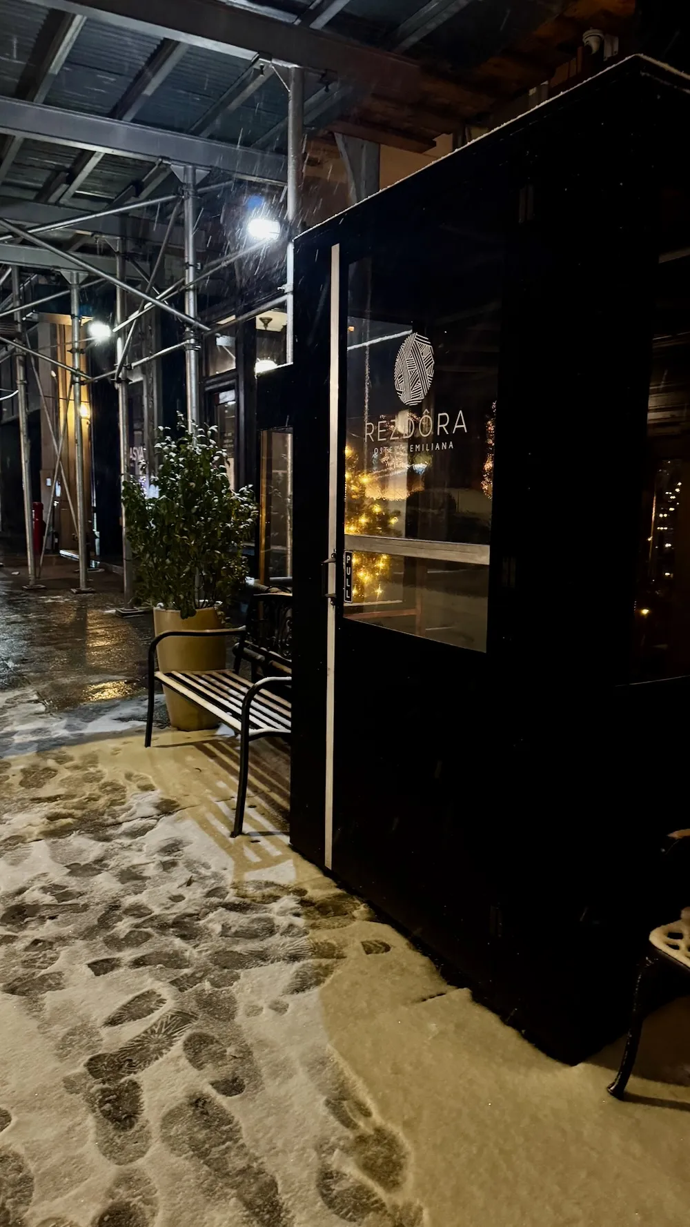 Exterior of Rezdôra restaurant in Flatiron on a snowy New York City night