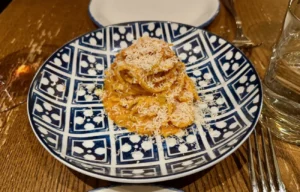 Tagliolini al ragù with grated cheese at Rezdôra in New York City