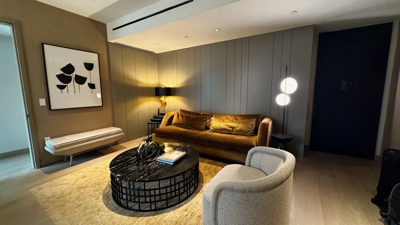 Modern hotel suite living room with plush seating and contemporary lighting at The Ritz-Carlton NoMad in New York City